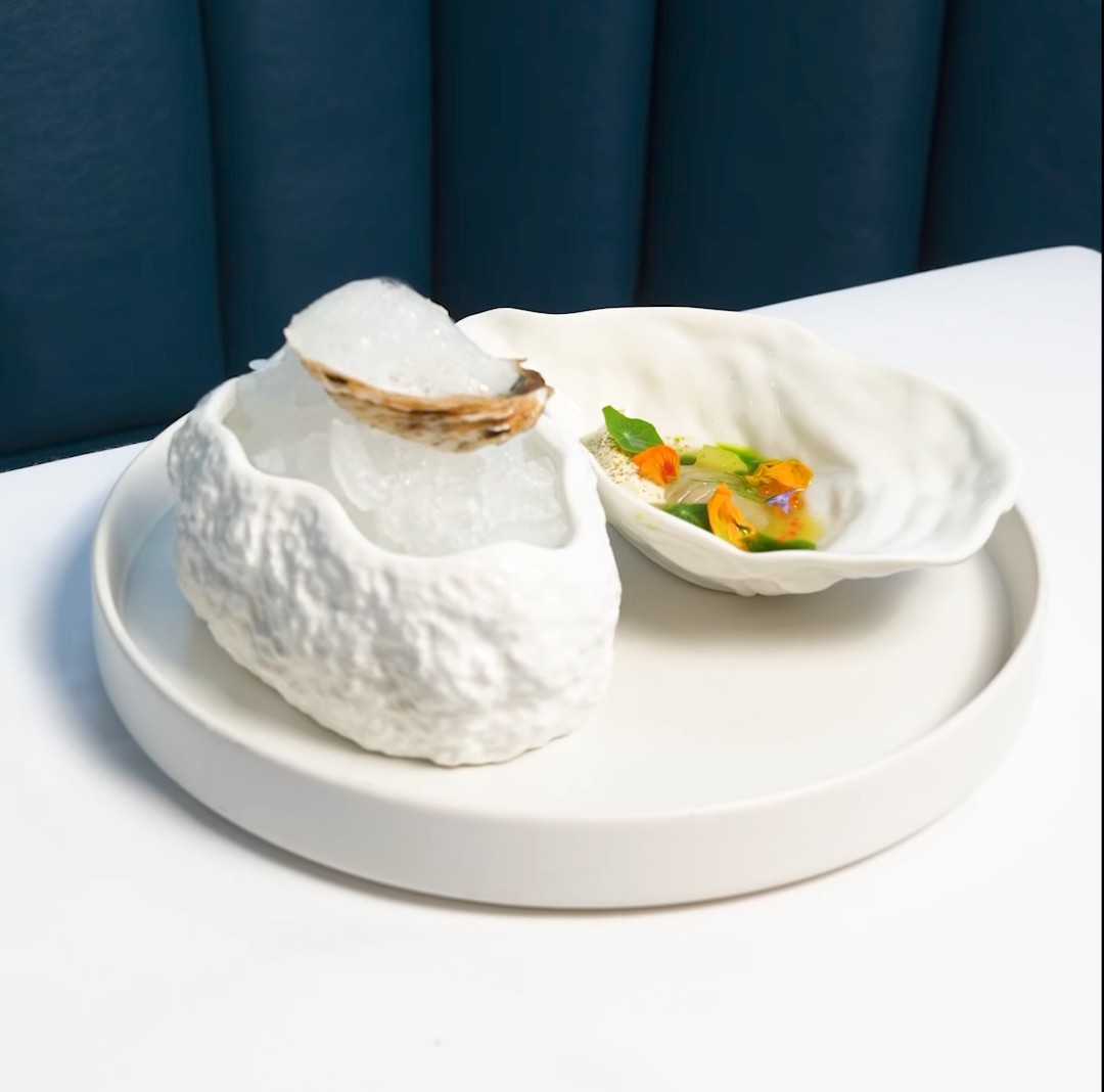 Dramatic tasting menu presentation at Aiana, Ottawa